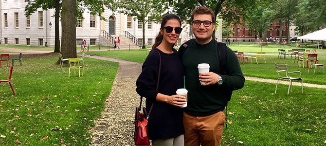 Amir Kaboodrangi and a friend posing with to-go coffee cups