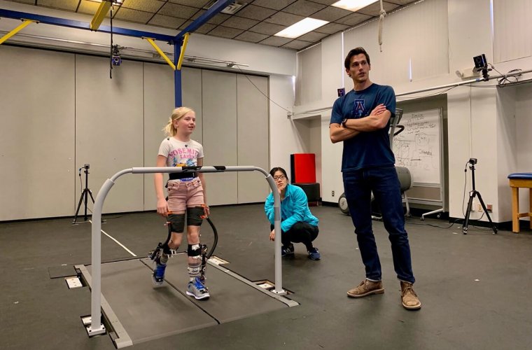 Ben Conner Observes a Robotic Exoskeleton Test Session with a Typically Developing Volunteer Ben Conner Observes a Robotic Exoskeleton Test Session with a Typically Developing Volunteer