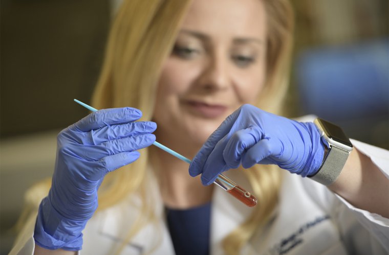 Dr. Herbst-Kralovetz examines vaginal bacteria in her lab Dr. Herbst-Kralovetz examines vaginal bacteria in her lab