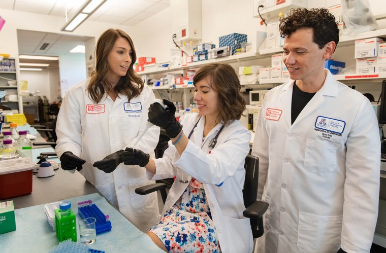 Rachel Rowe, PhD, Alona Sukhina, MD, and J. Bryce Ortiz, PhD, Working in the Lab Rachel Rowe, PhD, Alona Sukhina, MD, and J. Bryce Ortiz, PhD, Working in the Lab