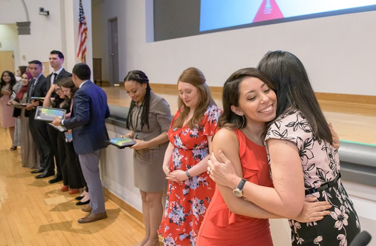 Graduating Pathways Student, Abigail Solorio, Hugs Dr. Maria Manriquez at the Ceremony Graduating Pathways Student, Abigail Solorio, Hugs Dr. Maria Manriquez at the Ceremony