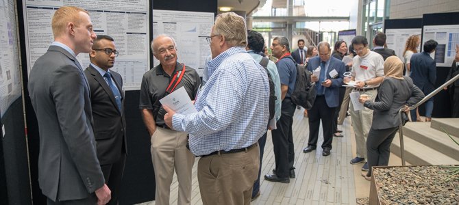 candid shot of group at the annual student research symposium