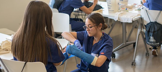 a summer scrubs student learning how to cast