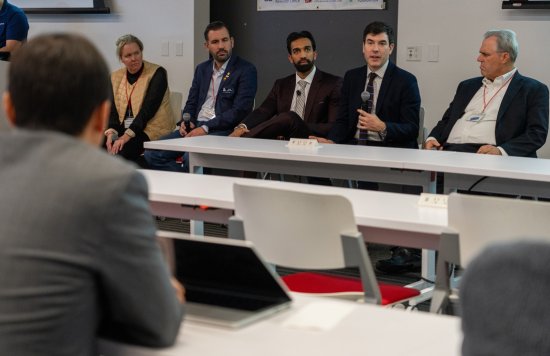 A business meeting or discussion in a professional setting.