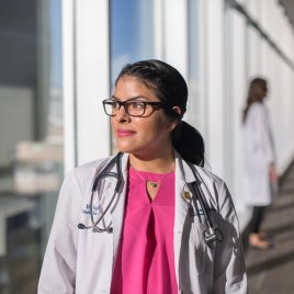 Former Medical Student Mia Wright Looks Out of a Window