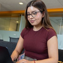 The student is learning something from the computer screen.